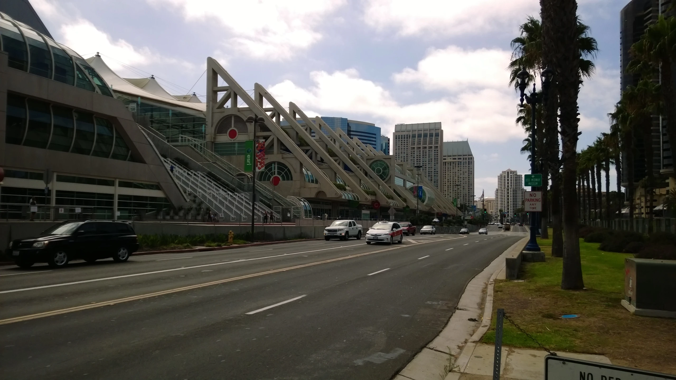 a highway with some tall buildings and cars on it