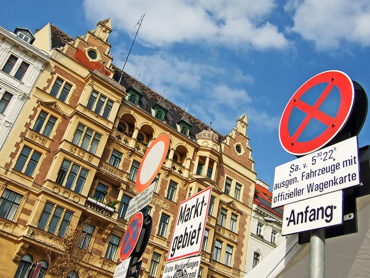 signs in different languages and symbols in front of a building