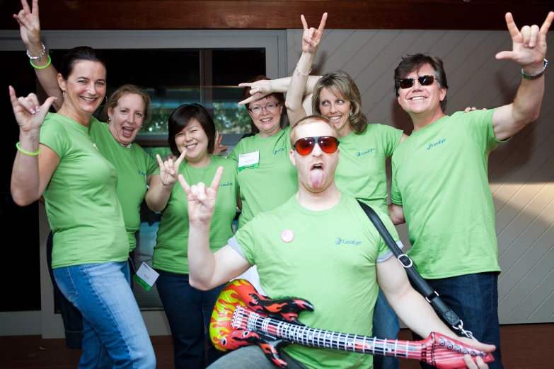 a group of people posing and making the vulcan sign