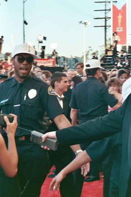 several police officers greeting each other on a red carpet