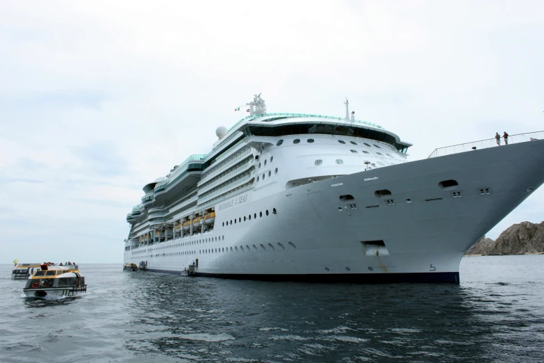 a large cruise ship docked in the open ocean