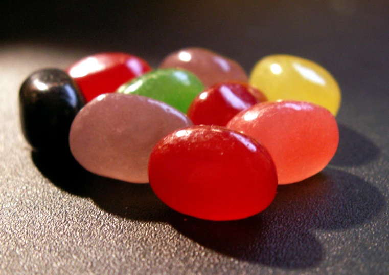 six candy balls laying together on the table
