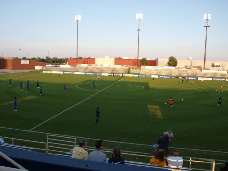 soccer field with people playing and playing a game