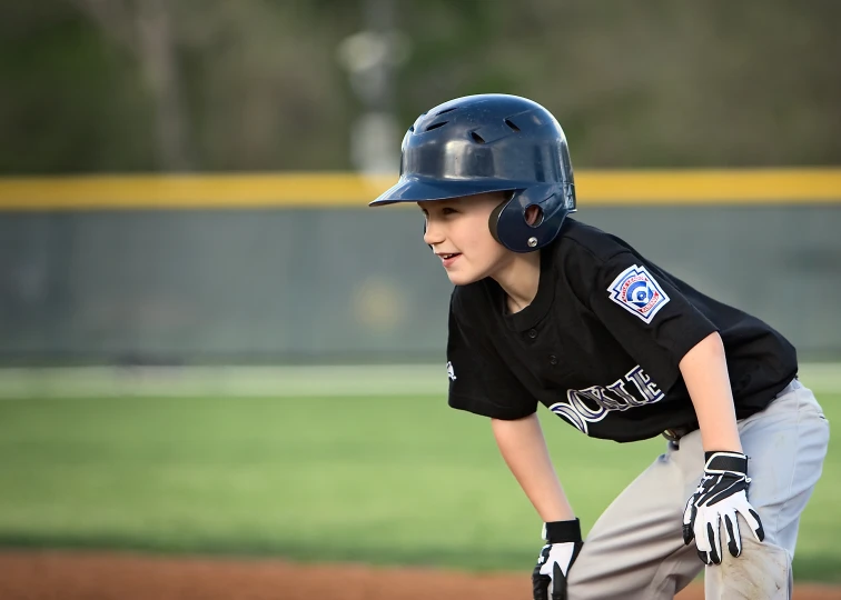 there is a male baseball player that is crouched down