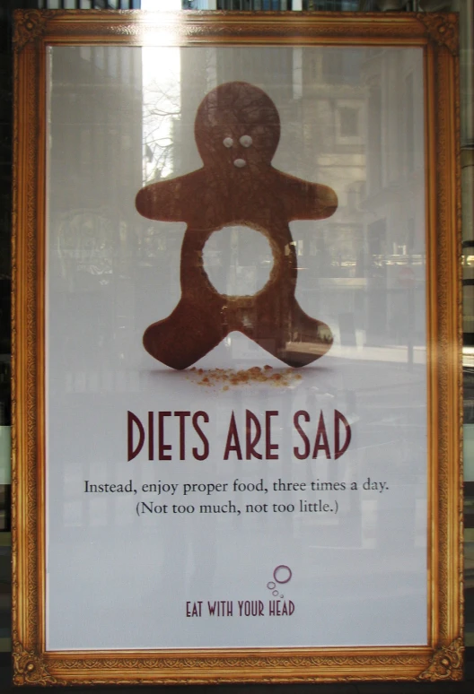 a sign that has been altered to show diets are sad