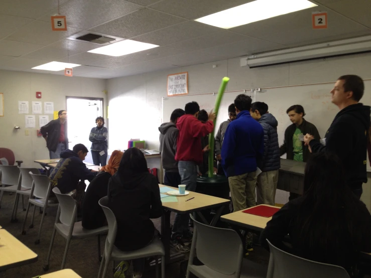 several people at desks having a class at a school