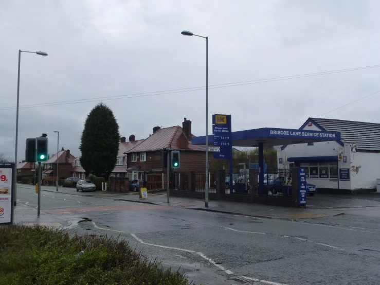 a gas station sitting on the side of the road