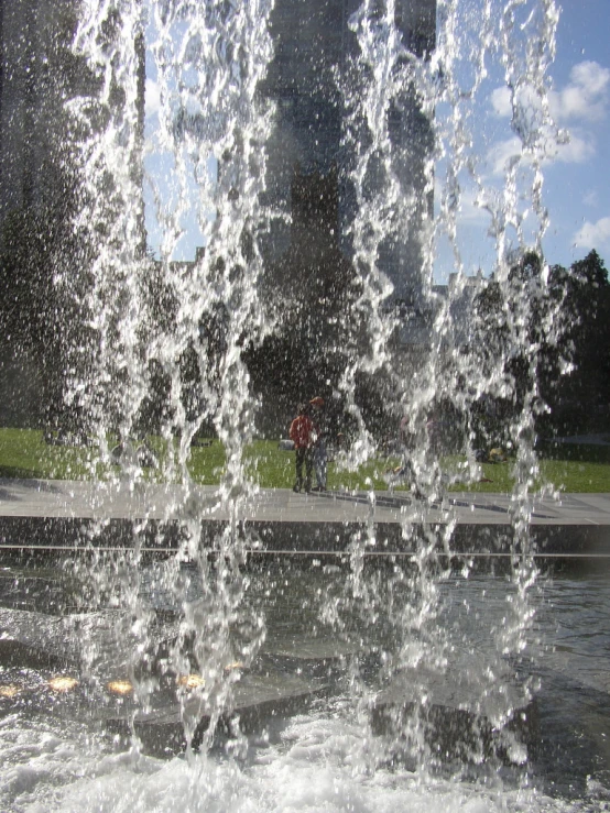 a spout of water spewing off of the ground