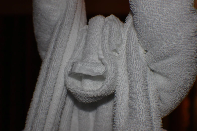 a close - up of a rolled towel folded in four