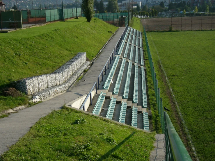 seats set up on a path leading to a field