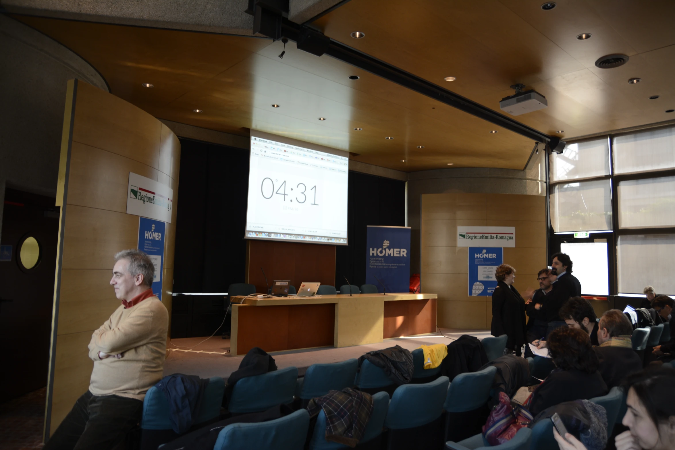 an image of a man speaking in front of a group