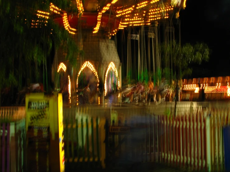 a carousel is lit up and it looks like a carnival