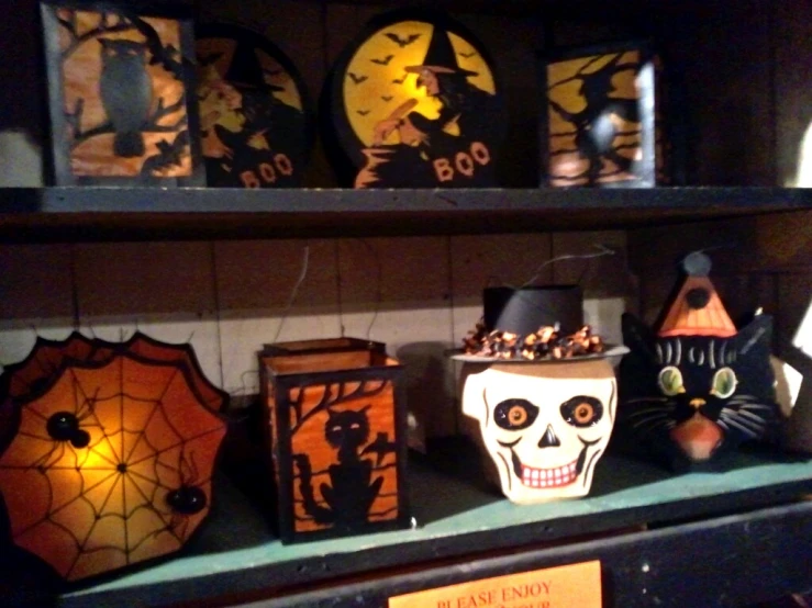 a shelf filled with lots of decorated halloween items