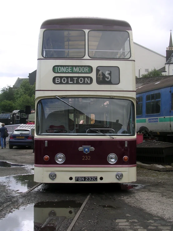 a double decker bus that is driving down the street