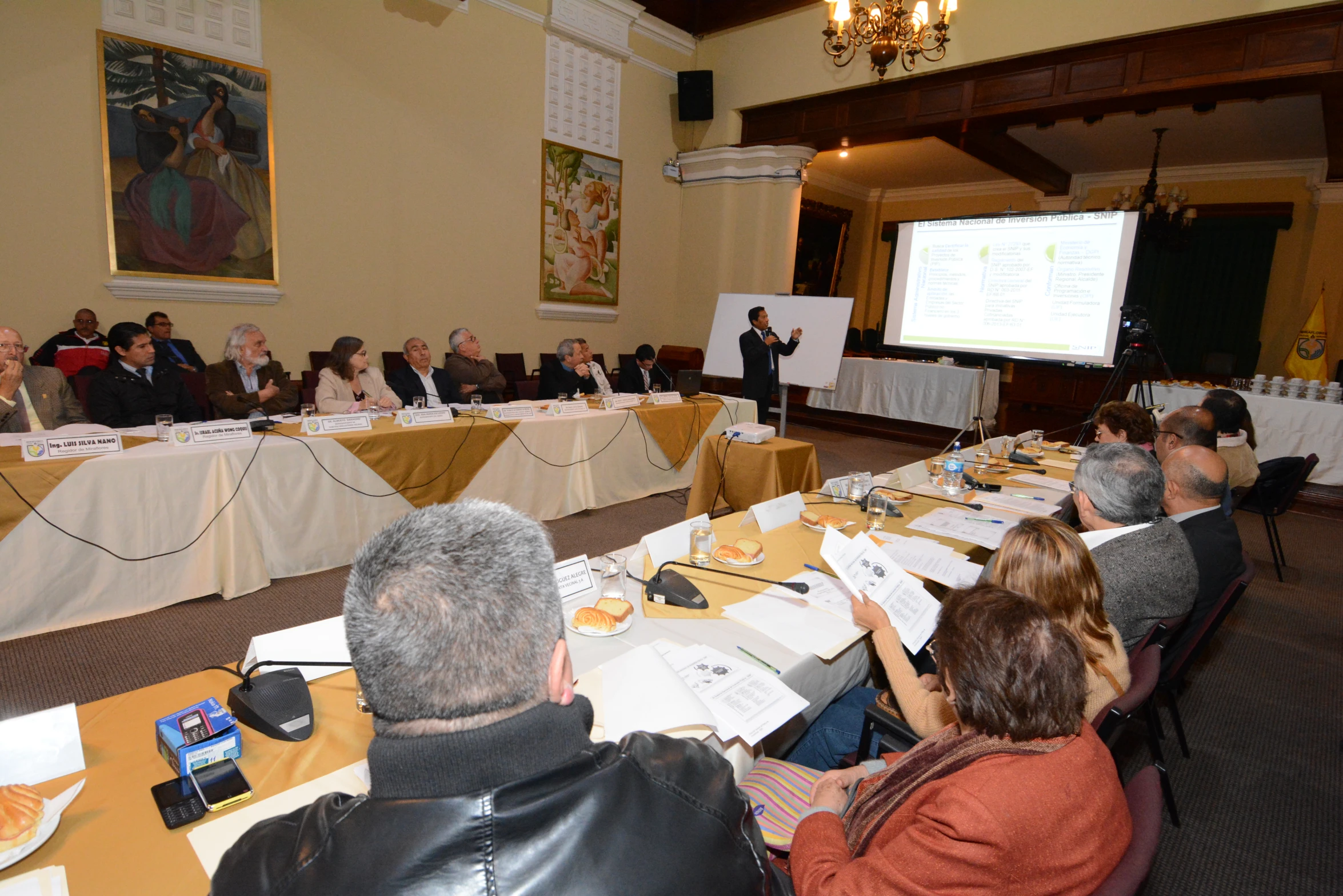 several people sitting in chairs during a conference