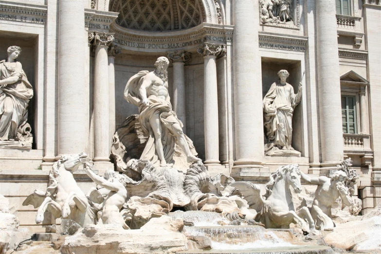 the statues at the top of the fountain of time are all in fancy marble