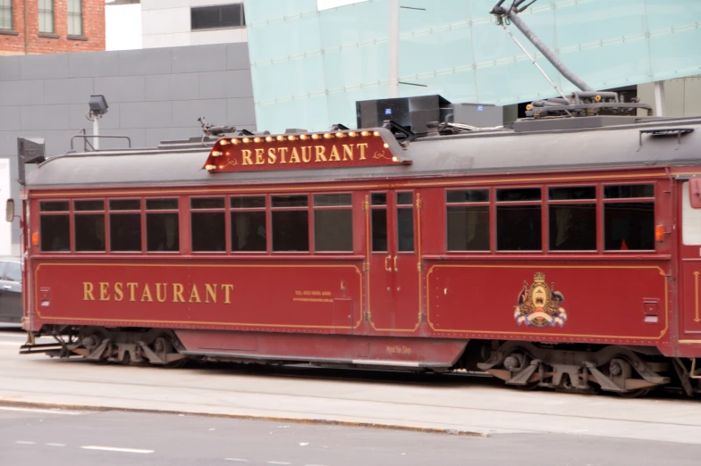 a trolley is parked on the side of the road