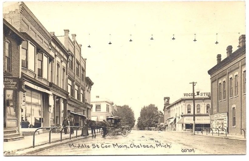 an old time picture shows people and buildings on the street