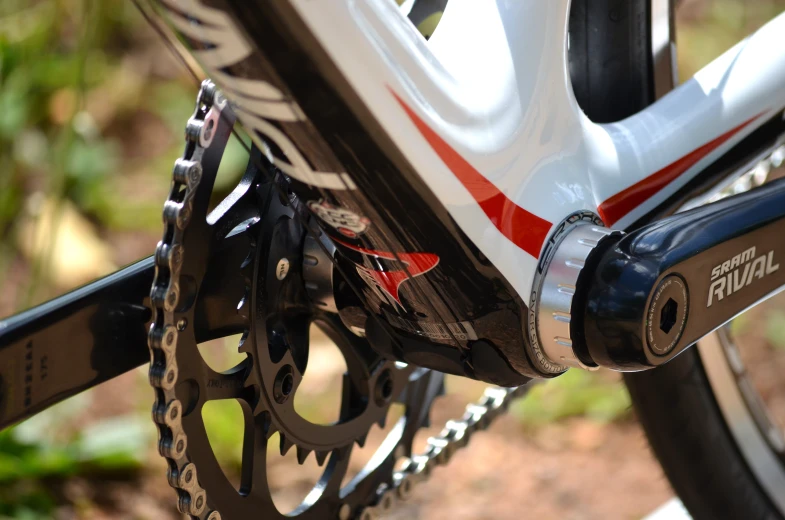 a white bike with some red and black letters