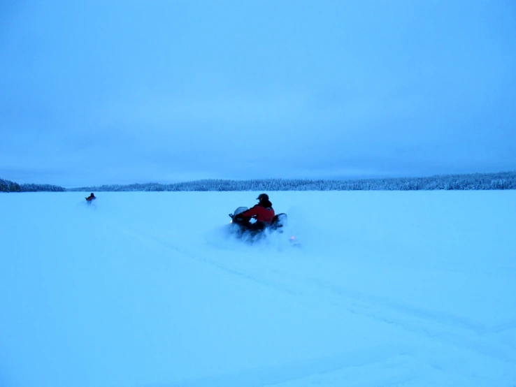 someone on a sled that is in the snow