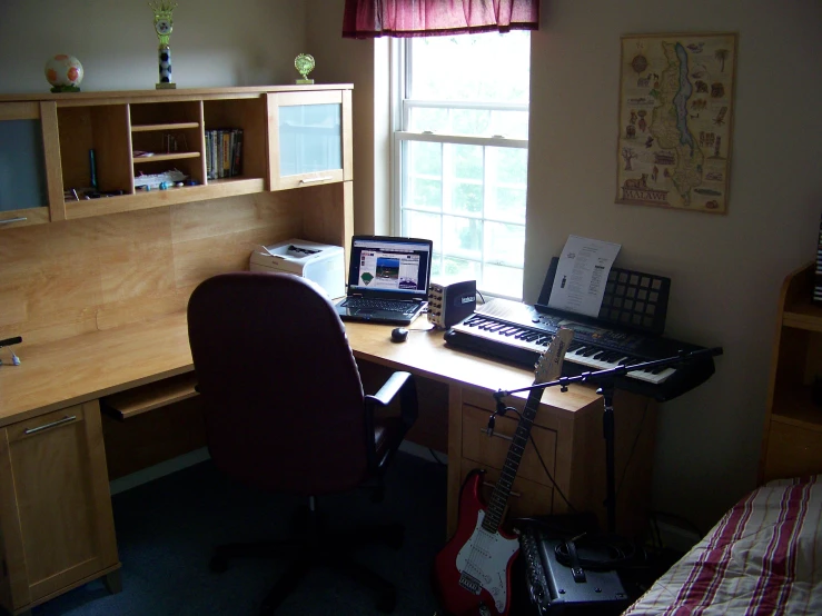 a desk with computers and other items on it