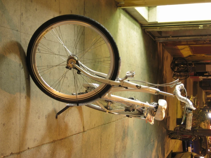 the bike is parked on the street at night