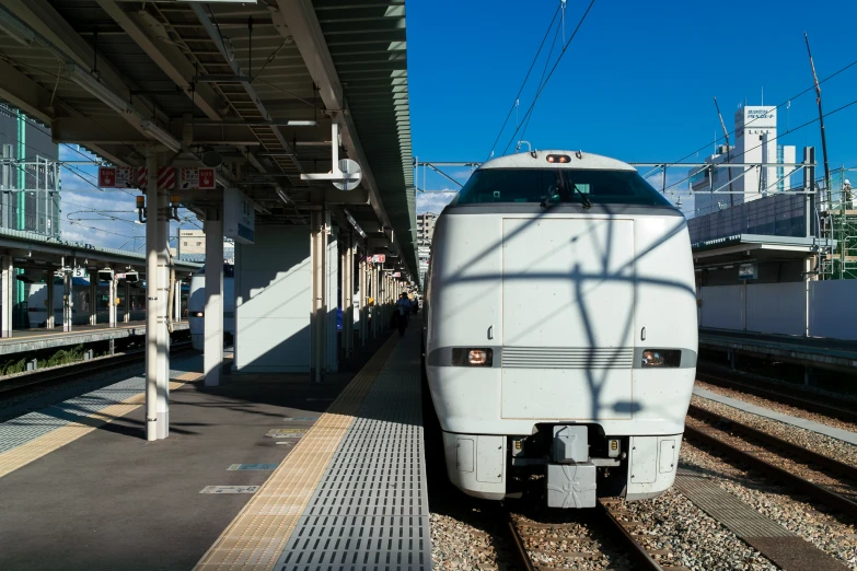 a train on the tracks in a city