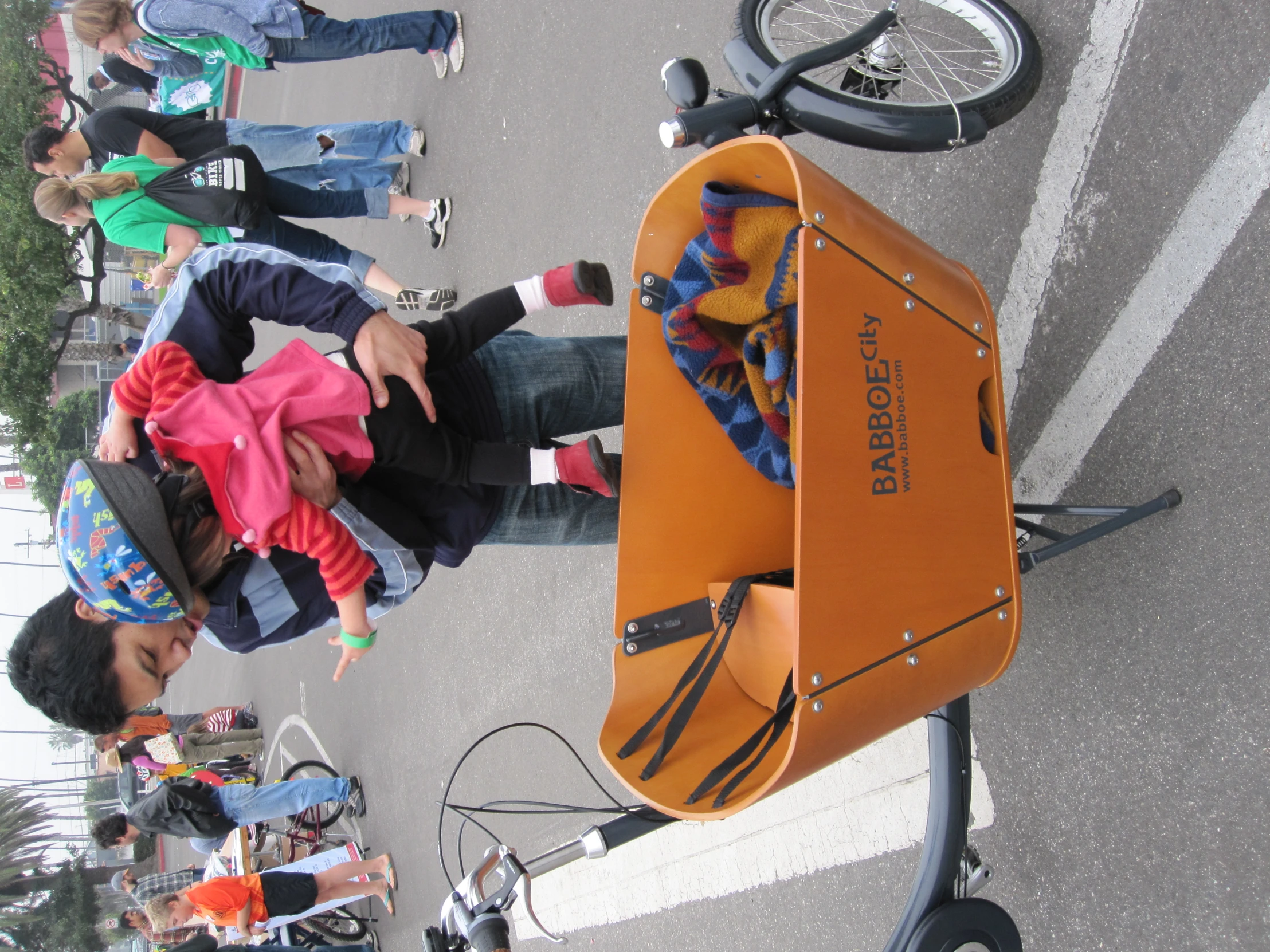 a little girl is standing in a orange luggage car