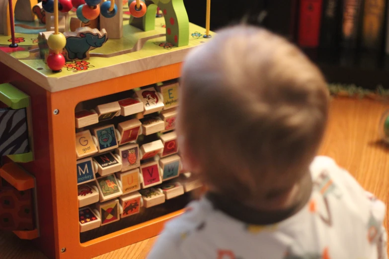 a baby is playing with toys on the floor