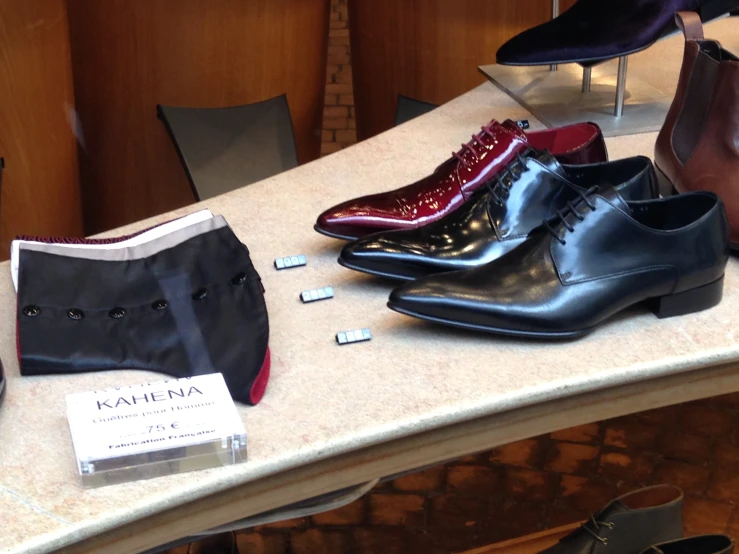 the row of pairs of shoes are on display