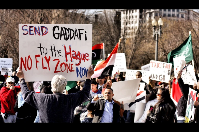 a group of people protesting in front of the parliament building