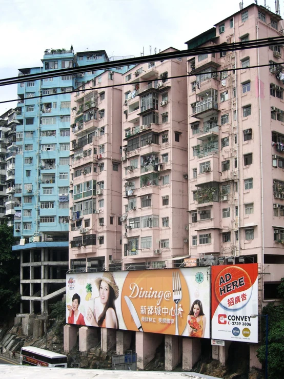 large advertit on the side of an overpass in a city