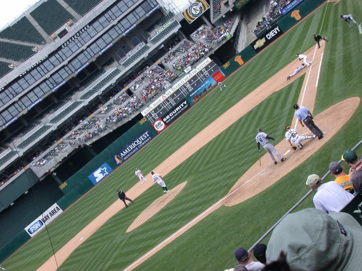 baseball game, as people and spectators are in the stands