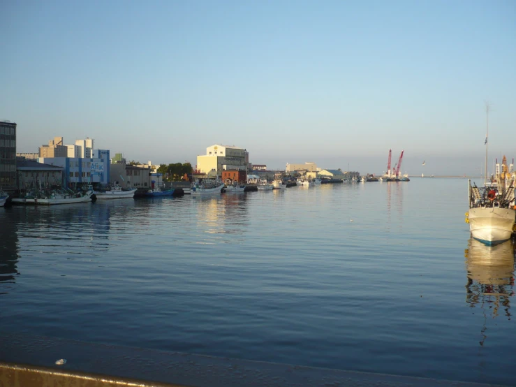 a harbor area of some sort with boats and buildings