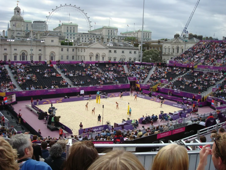 a group of people watching a court game