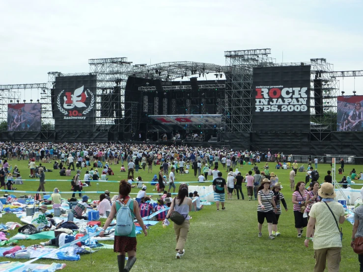 the people are standing around at the festival