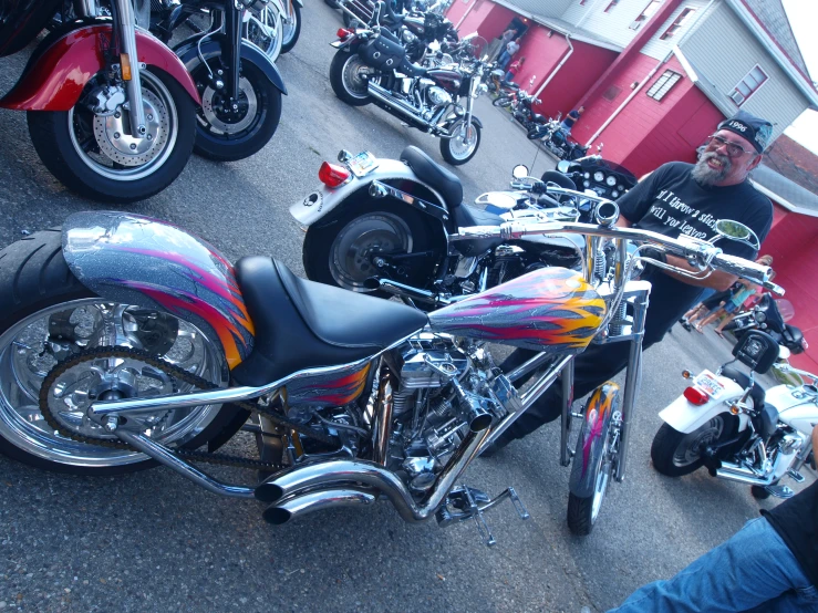 several colorful motorcycles parked beside each other in a parking lot