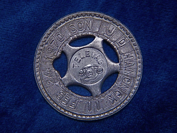 a police officer badge with writing and numbers