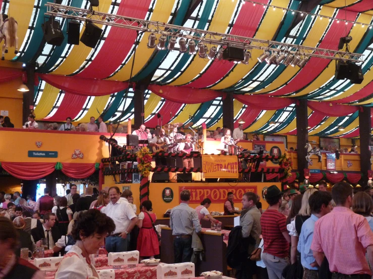 several people are seen at an indoor restaurant