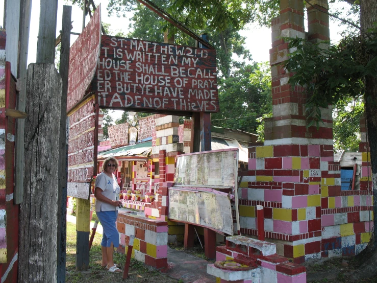 a woman is in front of a display of cardboard