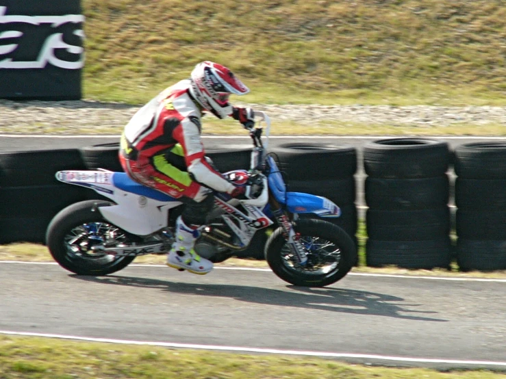 a person on a motorcycle going down the road