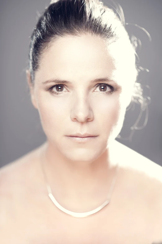 a young woman wearing a white choker and necklace