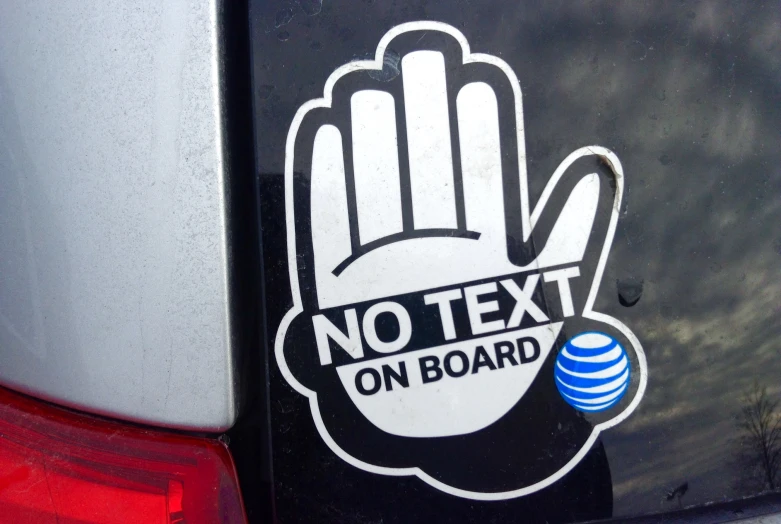 no text on board hand sign displayed in vehicle