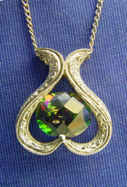 a green opal pendant on a silver chain