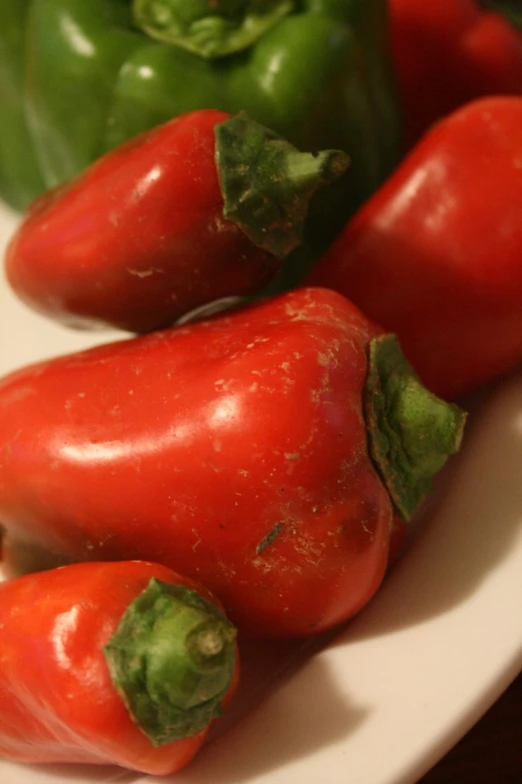 red and green peppers on a white plate