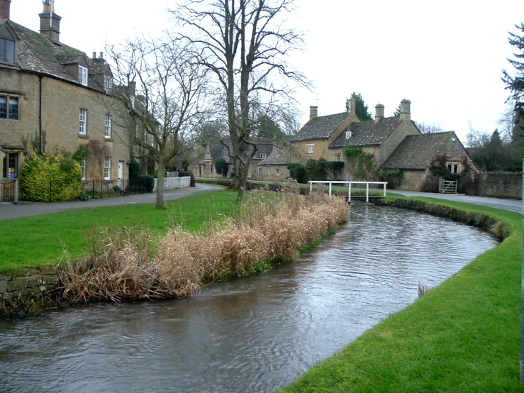 a body of water in front of some old buildings