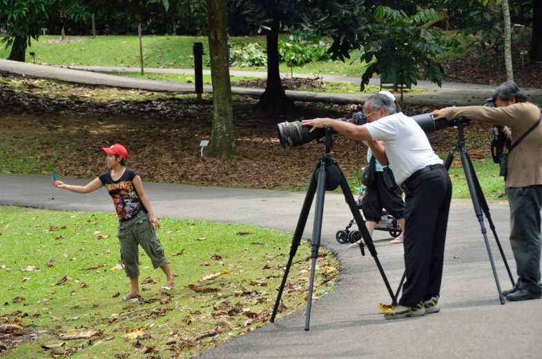 a person taking pictures of another person on the ground