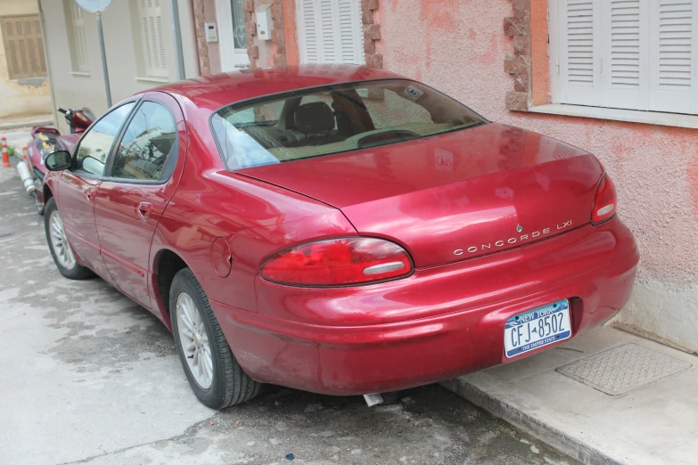 a red car that has had the door open