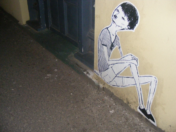 a painting with black and white lines of a boy sitting on the ground
