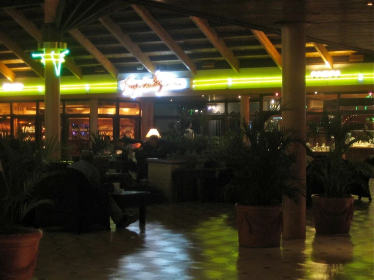a bar with lit up bars and seating